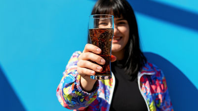 Woman drinking carbonaded soft-drink