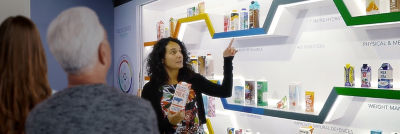 Woman with carton package in CIC workshop room