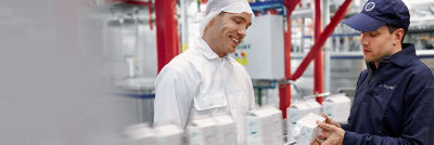 Customer and Tetra Pak operator, Tetra Rex line in background