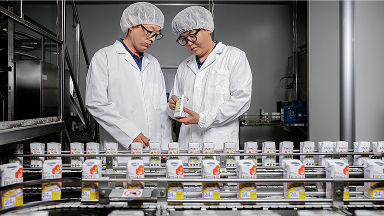 two Tetra Pak workers in a factory