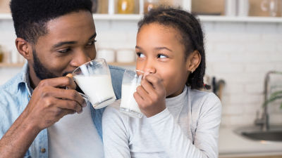Happy family drinking milk