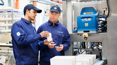 Tetra Pak experts, carton packages on distribution line
