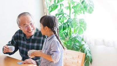 Grandfather talking with his granddaughter.