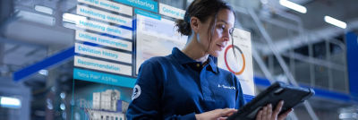 Female service engineer with tablet monitoring asset health data