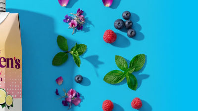 Blueberries, herbs, flowers and a food supplement and nutrition drink.