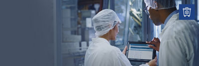 Food experts monitoring data on screen