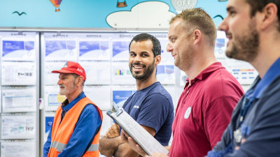 Four employees talking