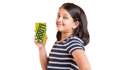 Girl holding Frooti package