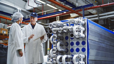 two people in front of equipment 
