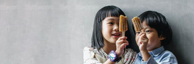 Two children eating ice cream