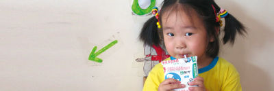 girl drinking from carton
