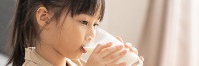 Girl drinking plant-based beverage