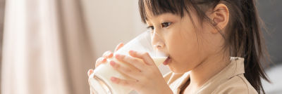 Girl drinking spent grain beverage
