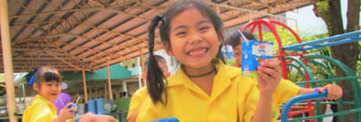 Kids with school milk in Tetra Pak packages
