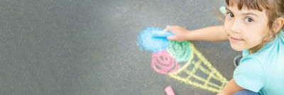 Girl painting ice cream with crayons