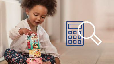 Girl playing with Tetra Recart carton packages