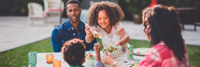 A Family eating outdoors