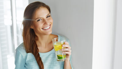 Woman Smiling Holding Glass 