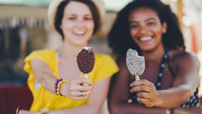 Girls eating popsicles