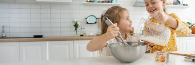 Girls in kitchen  baking, Tetra Recart 100 mini carton