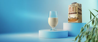 Oat drink in glass and carton pack