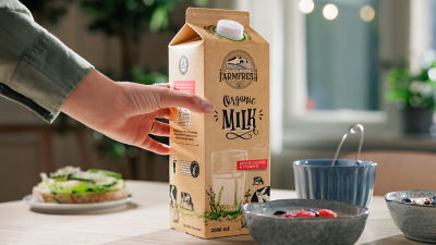 Organic milk in Tetra Rex carton package on breakfast table