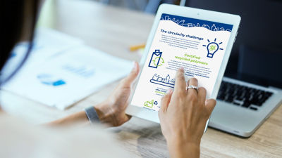 Hand scrolling on ipad with infographic