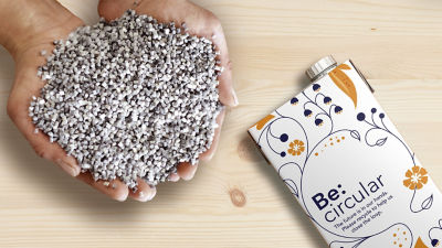 Hand holding polymers and a cartton package