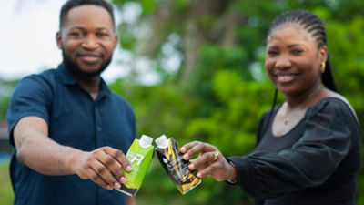 happy couple holding beverage packs