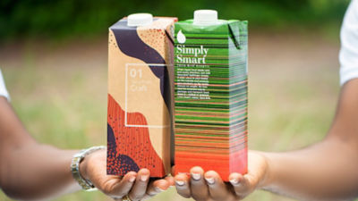 hands holding cartons