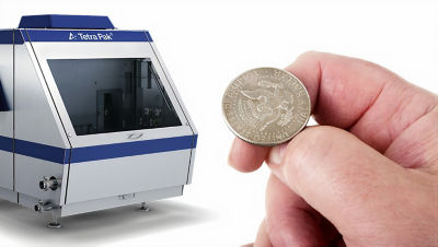 Tetra Pak Homogenizer 250 and hand showing 50 cents