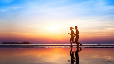 People jogging on the beach