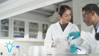 Lab staff discussing sample