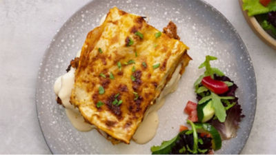 Lasagna on plate with salad