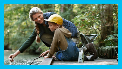 Woman and child at fishing pond