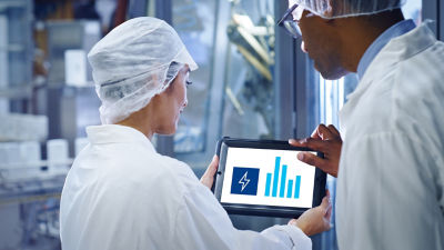 man and woman using tablet
