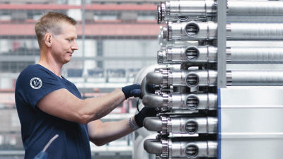 Man doing service on tubular heat exchanger