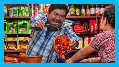 Shopping fresh tomatoes in local grocery store