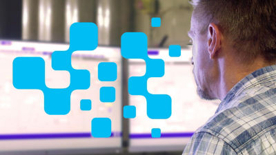 man looking at screen with blue graphics on left side