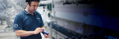 Man looking at spare part