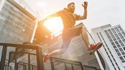 Man keeping his energy up by doing parkour