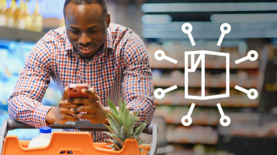 Man with smart phone in grocery store