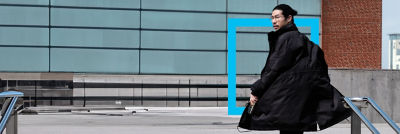 Man walking up stairs, turning around