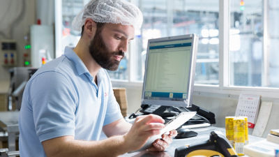 Food expert looking at data on tablet