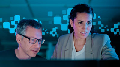 Man and woman with blue pixels around them 