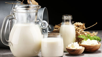 Milk in glass jug, glass and bottle