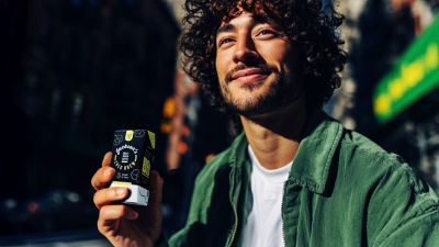 Man drinking rtd coffe from beverage carton