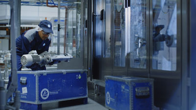 Operator and wooden boxes with spare parts