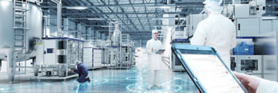 Operators monitoring production in food production plant, digital solutions