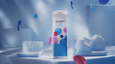 Tetra Stelo Aseptic carton package on table, blue background